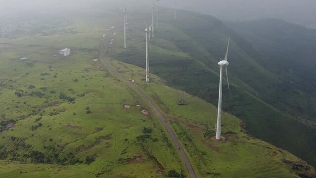 Windmills Near Taked Village Situated On Mountaintop Surrounded By Lush Greenery At Nashik, Maharashtra, India. -Drone, Zoom In