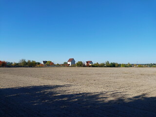 Panorama of a plowed autumn field