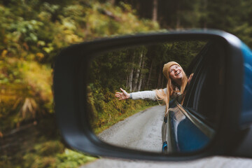 Road trip woman traveling by rental car adventure lifestyle vacation vibes outdoor forest view...