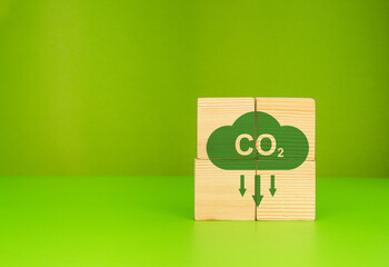 A Roadmap for the global energy sector. Wooden cubes with CO2 on a green background