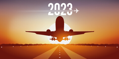 Carte de vœux 2023 pour les compagnies aériennes, montrant un avion prenant son envol, en décollant de la piste d’un aéroport devant un coucher de soleil. - obrazy, fototapety, plakaty