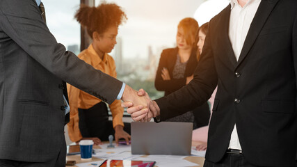 Shot crop of business people shaking hands inside office, Business meeting and partnership concepts.