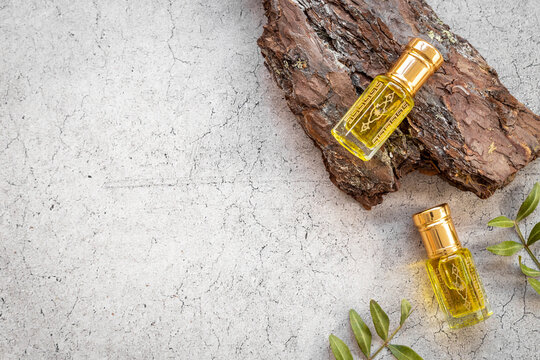Arabian oud attar oil - perfume in glass bottles. Overhead view