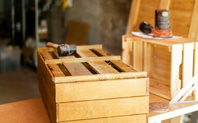 Wooden box and carpentry tools in carpentry workshop.