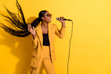 Photo of hooray millennial lady sing wear glasses suit isolated on yellow color background