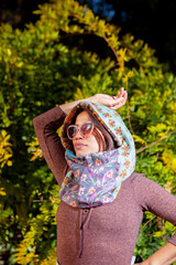 Outdoor portrait of woman, wearing colorful handkerchief