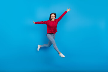 Fototapeta na wymiar Full body photo of celebrate young lady run wear eyewear shirt jeans shoes isolated on blue background