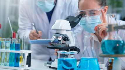 Scientist or researchers working in science laboratory, medical technology research work, science laboratory research and development concept.
