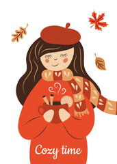 Greeting card with the inscription "Cozy autumn". A girl in knitted clothes holds a fragrant hot drink in her hands.