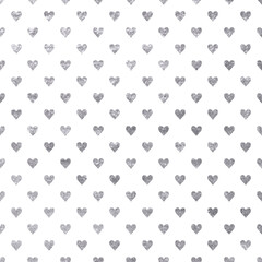 Silver glitter sparkles heart  on white background.