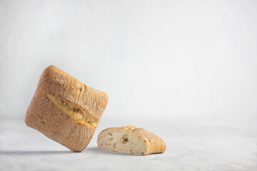 square ciabatta buns on a gray background with a copy space. bread made from wheat flour.