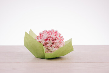 peony shaped cookies on a white wooden table on a white background. High quality photo