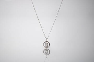 Silver necklace on blue background jewelry fashion 