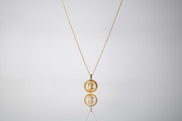 Gold necklace on grey background jewelry fashion 