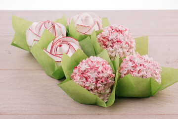 peony shaped cookies on a white wooden table on a white background. High quality photo