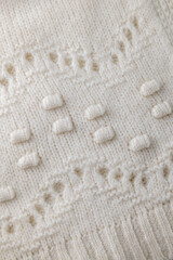 Fashionable knitted woolen cloth, warm soft textile close up view
