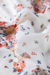 Obraz na płótnie Canvas Fashionable floral cloth, ondulate modern textile close up view