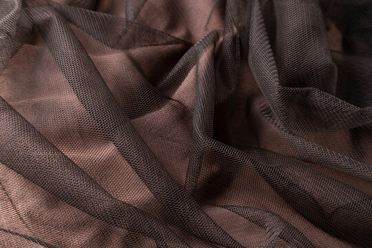 Fashionable brown tulle cloth, sofisticate textile close up view
