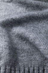 Woolen grey cloth, ondulate textile close up view