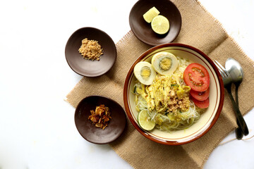 Soto Lamongan is a dish of Soup Lamongan, East Java, Indonesia. made of chicken, vermicelli, egg, bean sprout, turmeric, the broth and koya