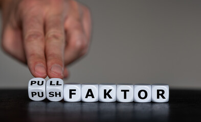 Dice form the German expression 'pull faktor' (pull factor) and 'push faktor' (push factor). Symbol...