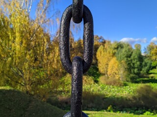 black chain in the park on a blurry background.