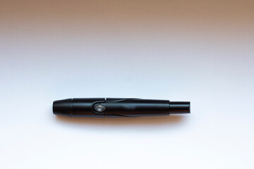 Finger piercing device for measuring blood sugar levels on an isolated background