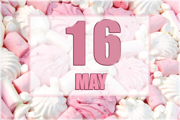 calendar date on the background of white and pink marshmallows. May 16 is the sixteenth day of the month