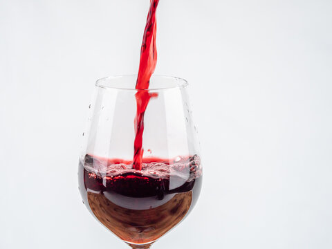 A glass of wine on a white background.