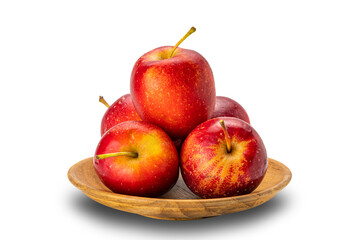 Pile of fresh ripe crisp snack-size mini apples or little apples or small apples in wooden plate on white background with clipping path.