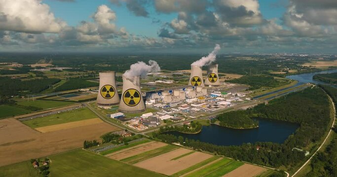 Aerial drone shot nuclear power plant. Horrific smoke billows high into the sky. Nuclear power plant. Atomic power stations are very important sources of electricity with low carbon footprint