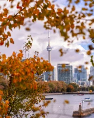 Poster Colorful fall foliage framing the Toronto skyline from Ontario Place and Inukshuk park © Scott Heaney