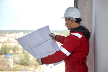 A specialist repairs an antenna on the roof. Rope access	