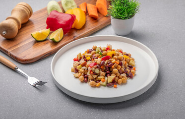 Overnight soaked legume salad of chickpea-kidney beans and other raw veggies mixed with herbs and mild spices