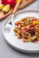 Overnight soaked legume salad of chickpea-kidney beans and other raw veggies mixed with herbs and mild spices