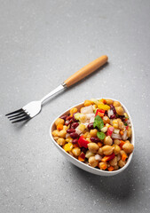 Overnight soaked legume salad of chickpea-kidney beans and other raw veggies mixed with herbs and mild spices