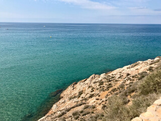 Salou, Spain, June 2019 - A rocky island in the middle of a body of water