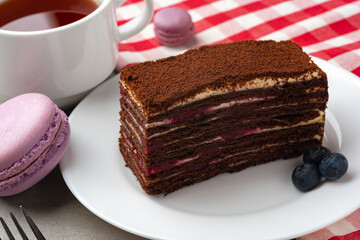Slice of homemade chocolate honey cake on plate