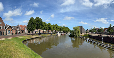 Fototapeta na wymiar Panorama from a canal and the architecture in the old city of Franeker