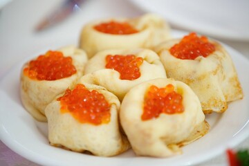 Delicious fish caviar canapes. Seafood in the diet. Decoration of the festive table.