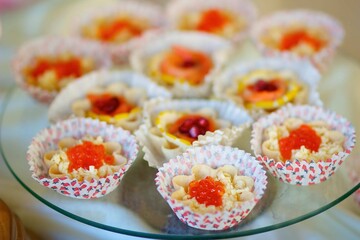 Delicious fish caviar canapes. Seafood in the diet. Decoration of the festive table.
