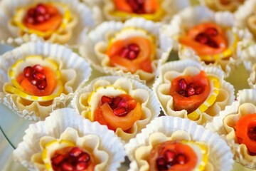 A delicacy of red fish on the festive table. Snacks for guests at the event.