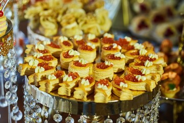 Delicious fish caviar canapes. Seafood in the diet. Decoration of the festive table.