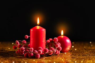 Merry Christmas and Happy New Year! Red candles on gold and black background