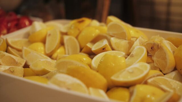 Chopped limon close up. Display showcase with freshly prepared meals in self-service cafeteria or buffet restaurant.