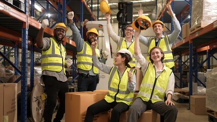 Professional warehouse worker team celebrating success in warehouse factory, Cheerful workers...