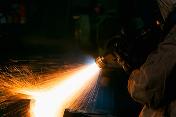 Welder repair gear overhaul housing bore by Wire Arc Spraying stainless steel coating process in factory workshop.