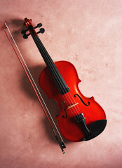 Obraz na płótnie Canvas violin on pink background studio shot