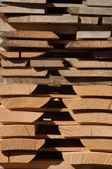 wood boards piled up in the warehouse of a carpentry