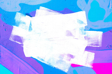 Closeup of colorful purple, pink, blue urban wall texture with white white paint stroke. Modern...